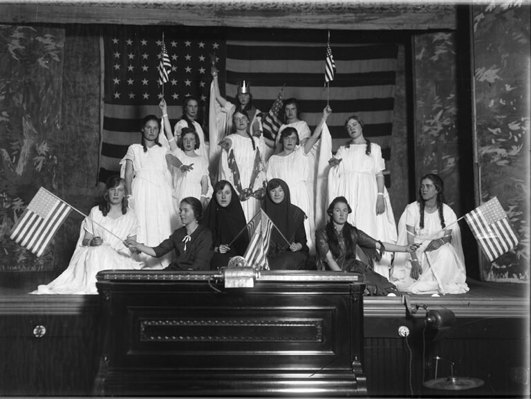 14 young women on Wheeler stage circa 1889